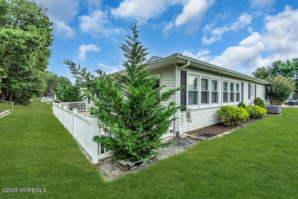 16 Thames Place Brick, NJ 08723 - Photo 27 of 28 a view of a house with a yard and plants