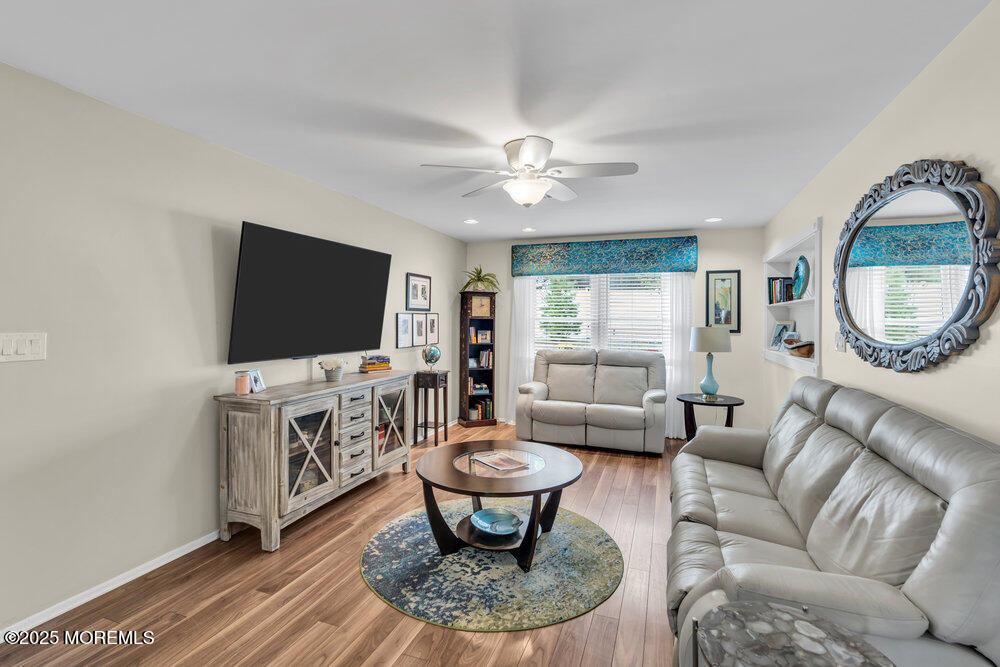 16 Thames Place Brick, NJ 08723 - Photo 6 of 28 a living room with furniture a flat screen tv and a window