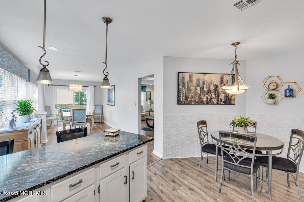 16 Thames Place Brick, NJ 08723 - Photo 10 of 28 a kitchen with counter space dining table and chairs
