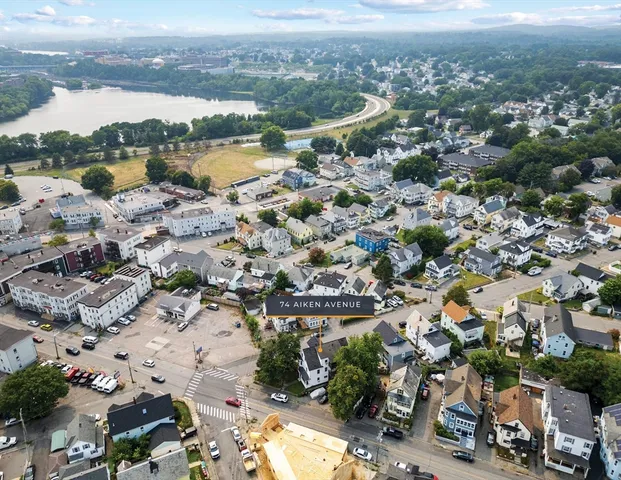 an aerial view of city and lake