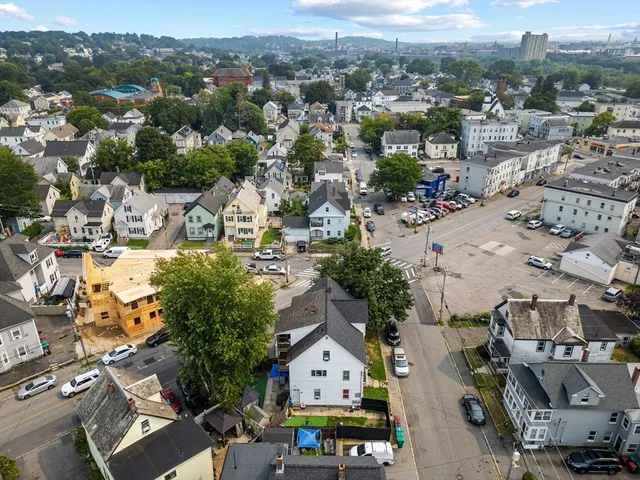 an aerial view of residential houses with outdoor space