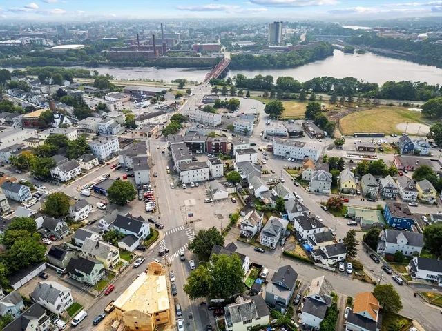 an aerial view of residential building and lake