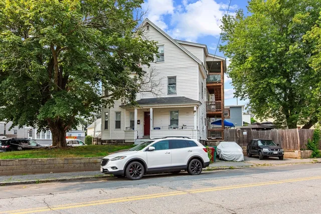 a car parked in front of a house