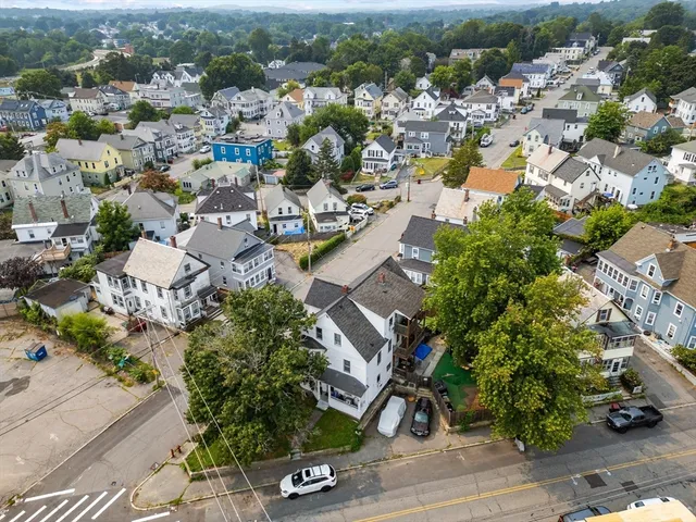 an aerial view of residential houses with outdoor space