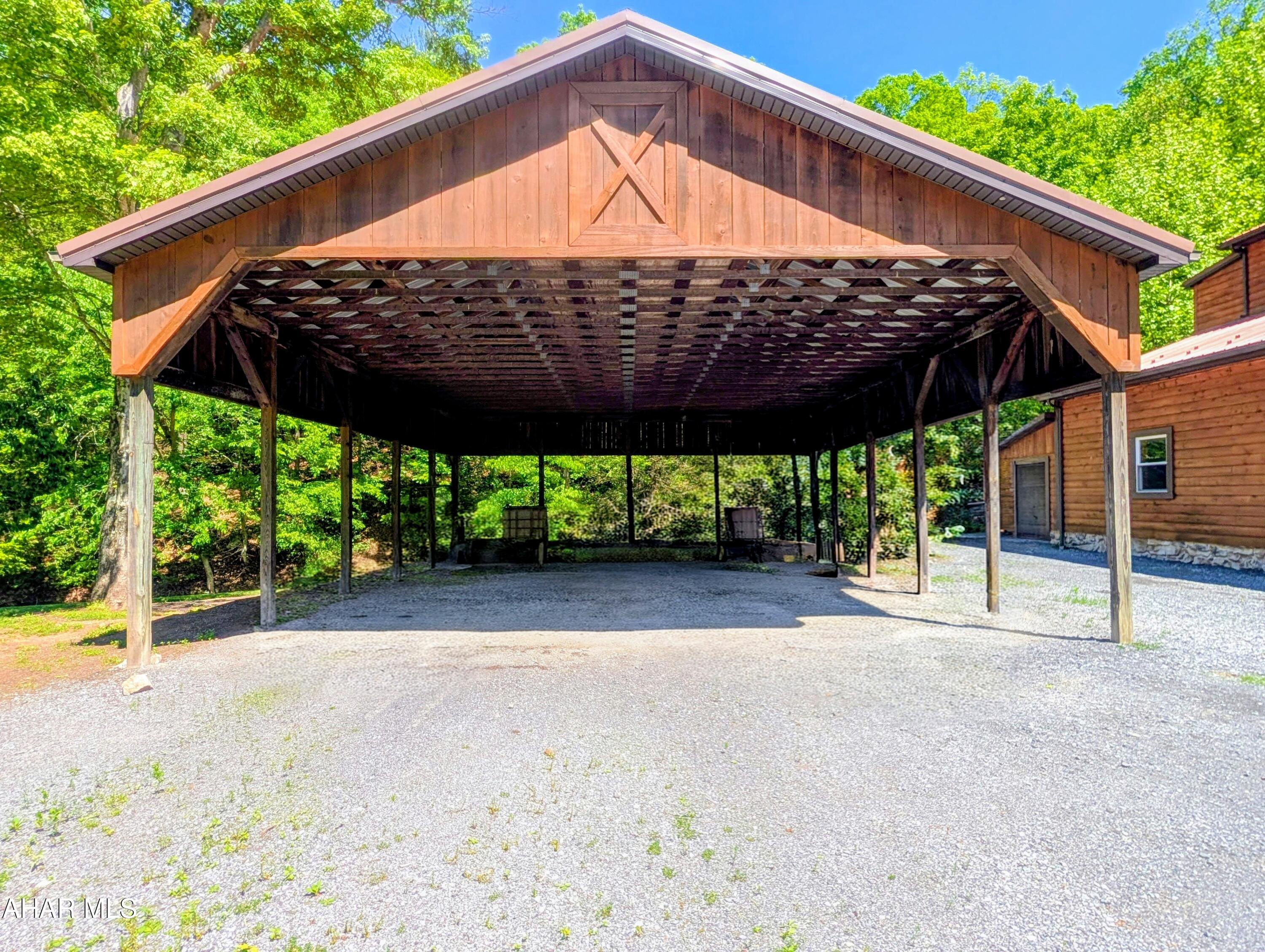 213 Sherman Valley Road Hopewell, PA 16650 - Photo 75 of 104 a view of a wooden deck with a yard