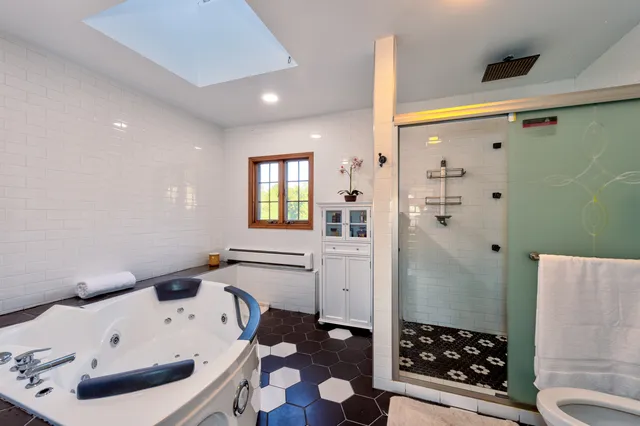 a bathroom with a bathtub sink and toilet