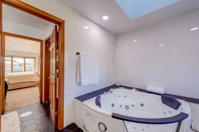 a bathroom with a tub and shower