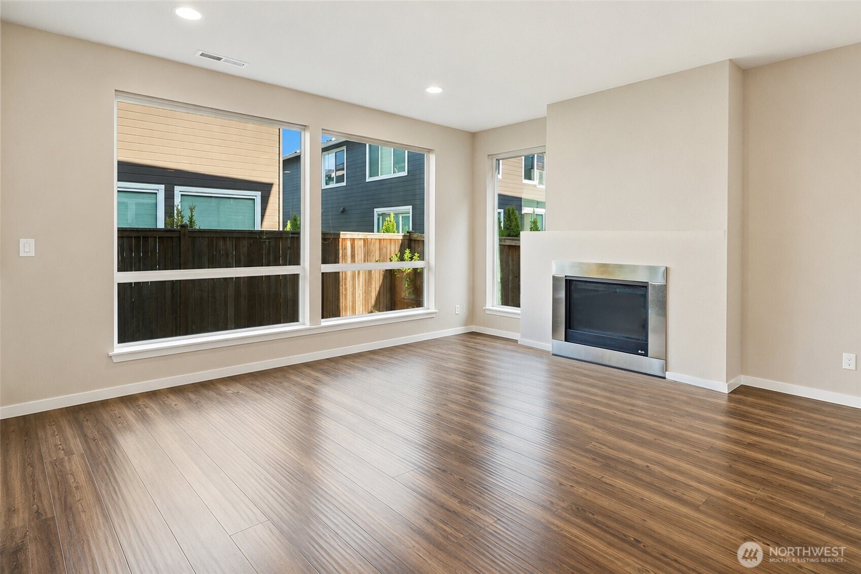 17227 39th Drive Southeast Bothell, WA 98012 - Photo 3 of 22 an empty room with wooden floor and fireplace
