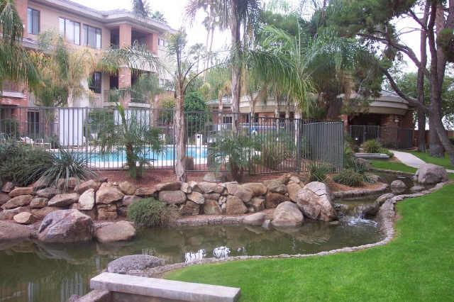 4488 East Thomas Road, Unit 1034 Phoenix, AZ 85018 - Photo 2 of 6 a view of a lake with a house