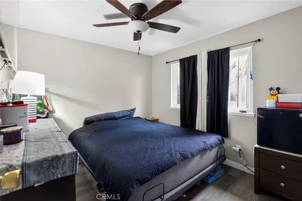 a bedroom with a bed and a dresser