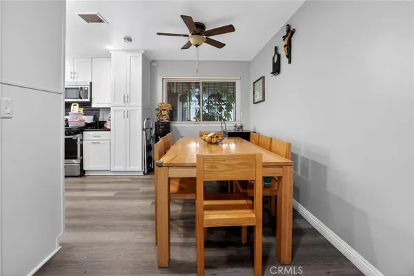 a view of kitchen with furniture and microwave