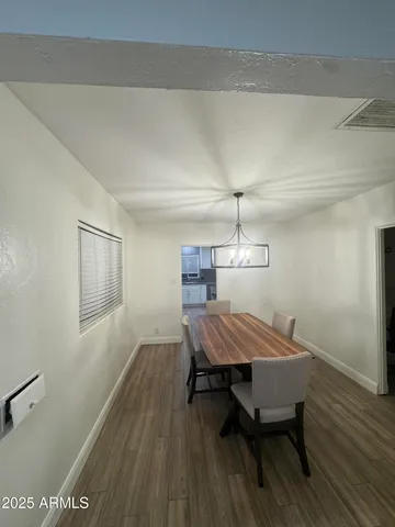 a kitchen with stainless steel appliances granite countertop a refrigerator a stove top oven a sink and dishwasher