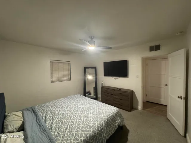a bathroom with a sink a large mirror and shower