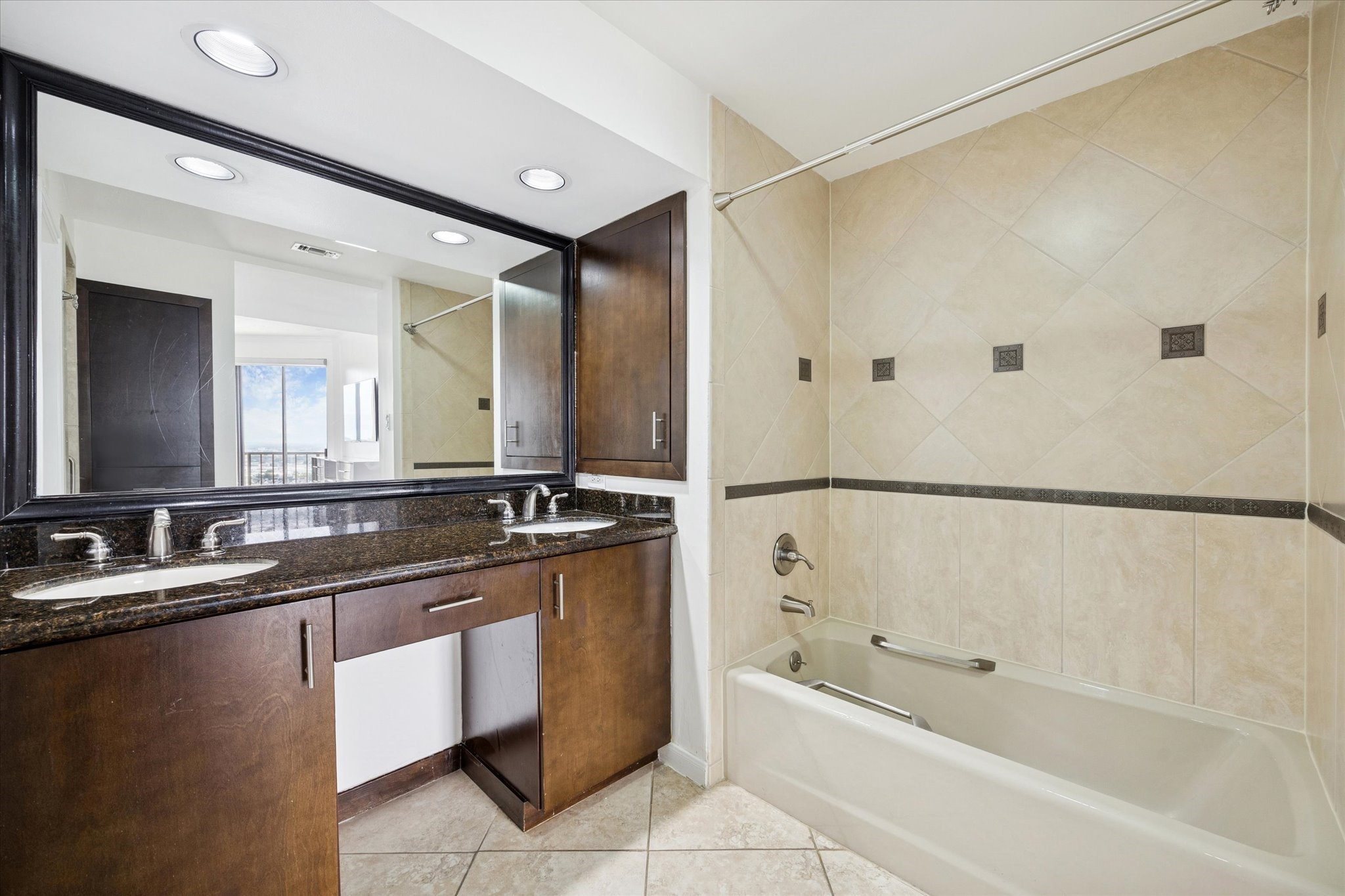 3350 McCue Road, Unit 2201 Houston, TX 77056 - Photo 15 of 27 a bathroom with a granite countertop sink mirror and a bathtub