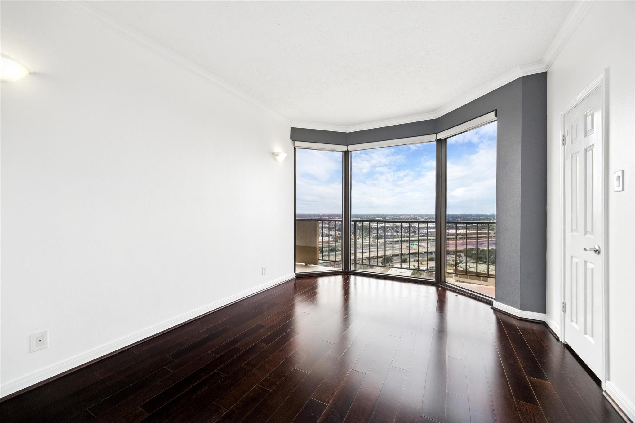 3350 McCue Road, Unit 2201 Houston, TX 77056 - Photo 16 of 27 an empty room with wooden floor and windows