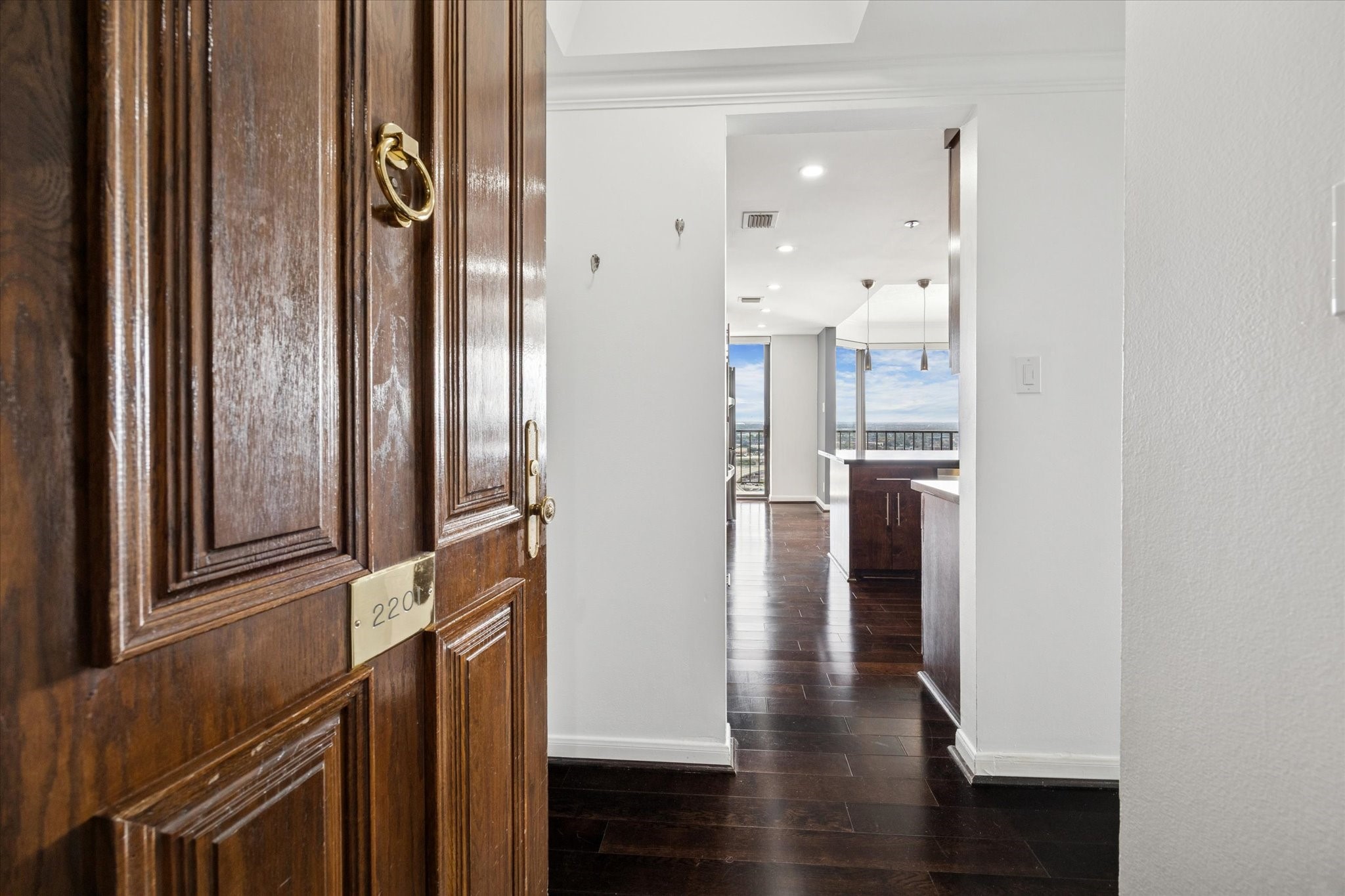 3350 McCue Road, Unit 2201 Houston, TX 77056 - Photo 19 of 27 a view of entryway and hall with wooden floor
