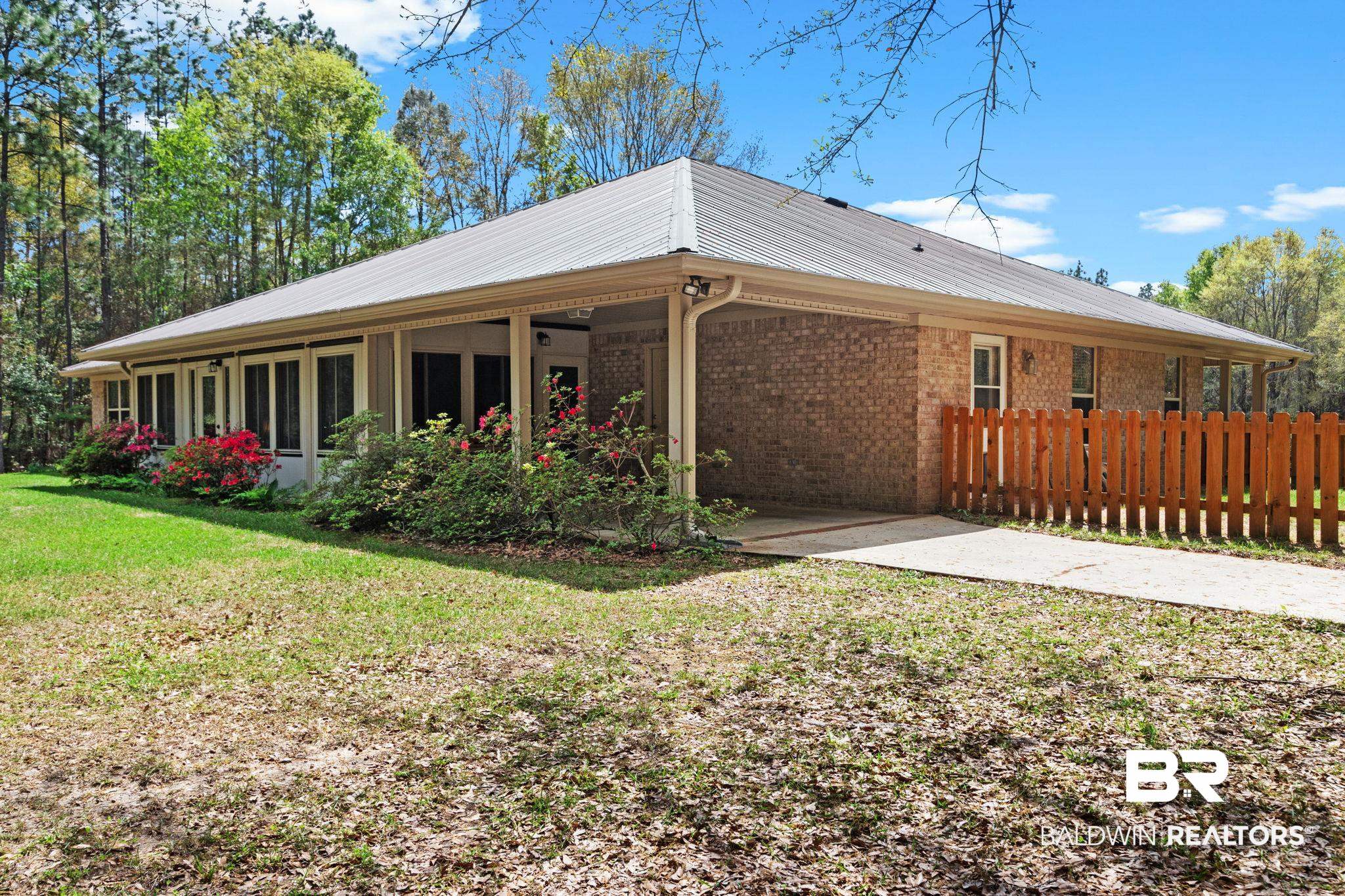 24250 Hack Road Bay Minette, AL 36507 - Photo 44 of 88 Rear view of house with a carport and brick siding