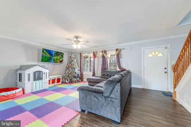 a living room with furniture and a rug