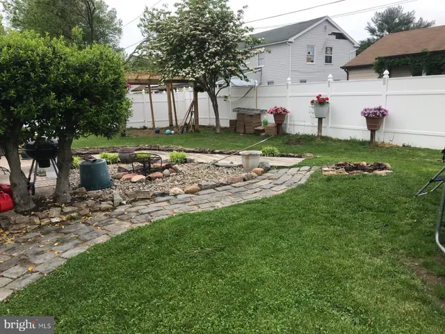 a view of a backyard with a sitting area