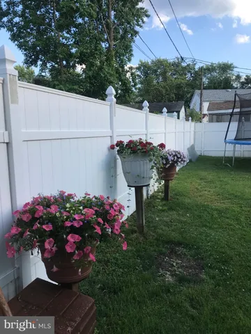 a view of a backyard with sitting area