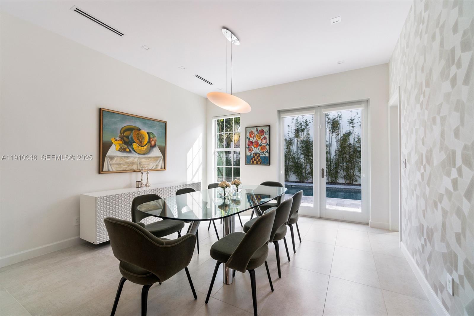 19941 Northeast 36th Place Aventura, FL 33180 - Photo 11 of 39 a dining room with furniture and window