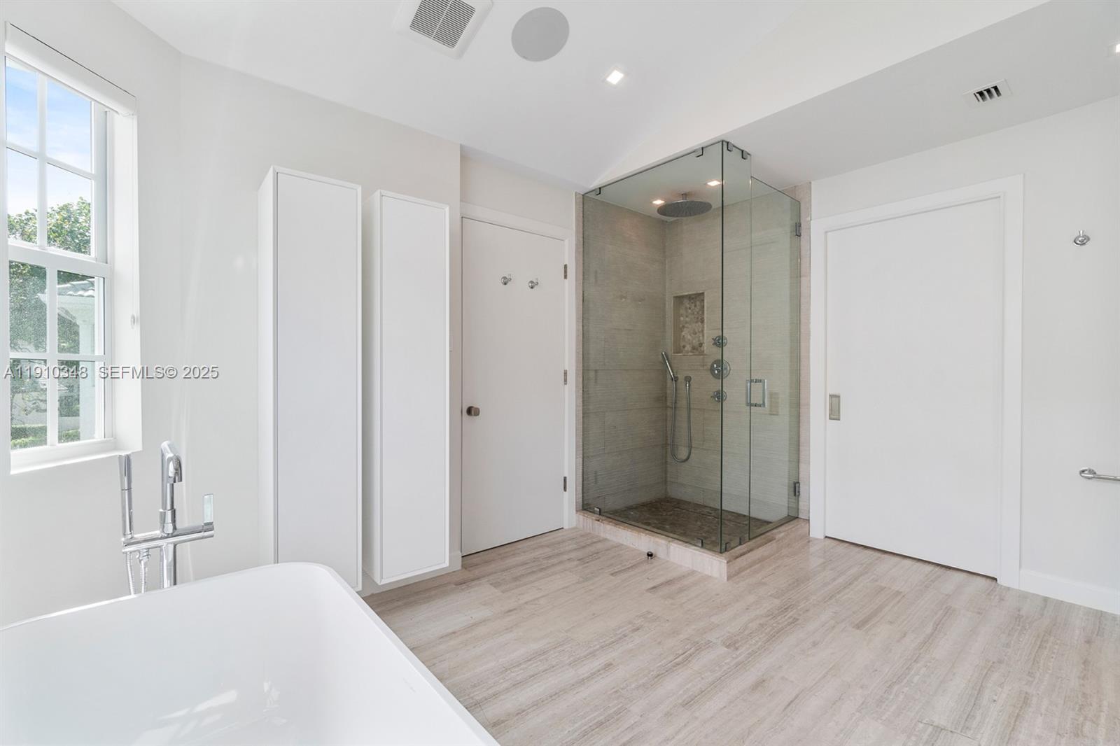 19941 Northeast 36th Place Aventura, FL 33180 - Photo 24 of 39 a bathroom with a shower and a tub