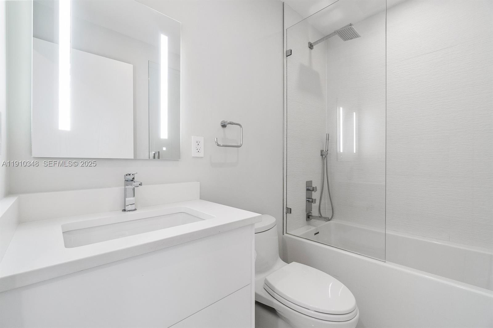 19941 Northeast 36th Place Aventura, FL 33180 - Photo 27 of 39 a bathroom with a sink toilet and shower