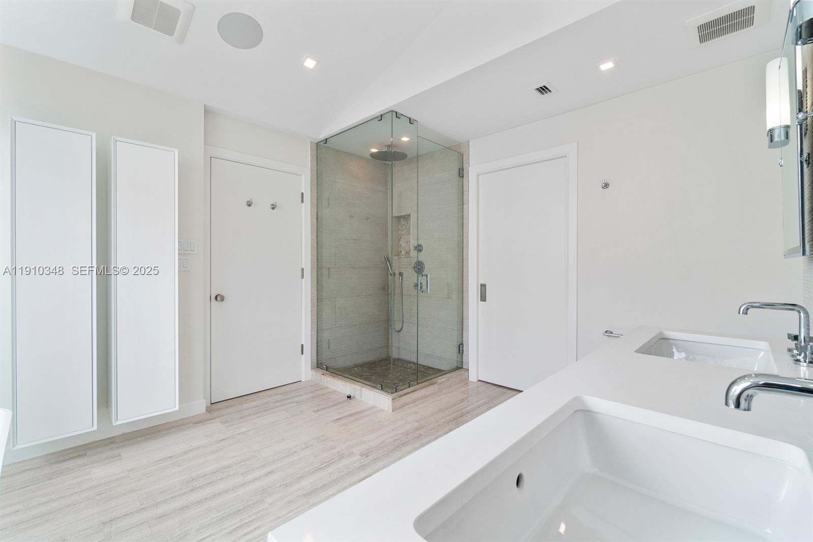 19941 Northeast 36th Place Aventura, FL 33180 - Photo 35 of 39 a bathroom with a tub shower and sink