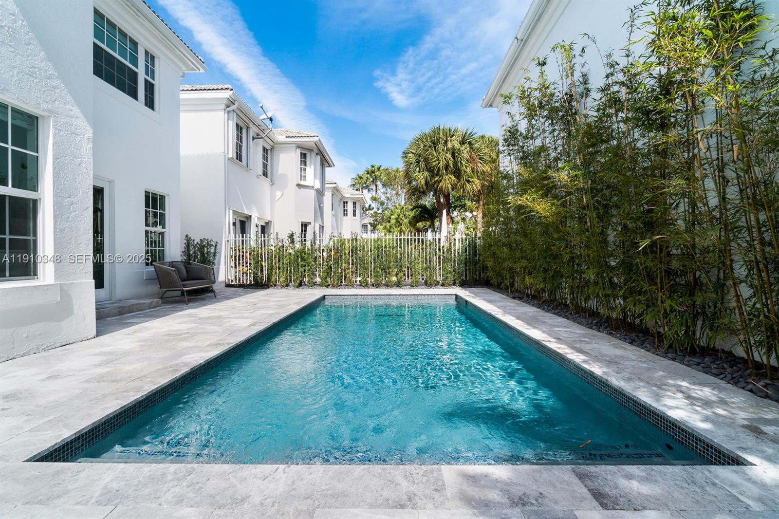 19941 Northeast 36th Place Aventura, FL 33180 - Photo 36 of 39 a swimming pool with outdoor seating