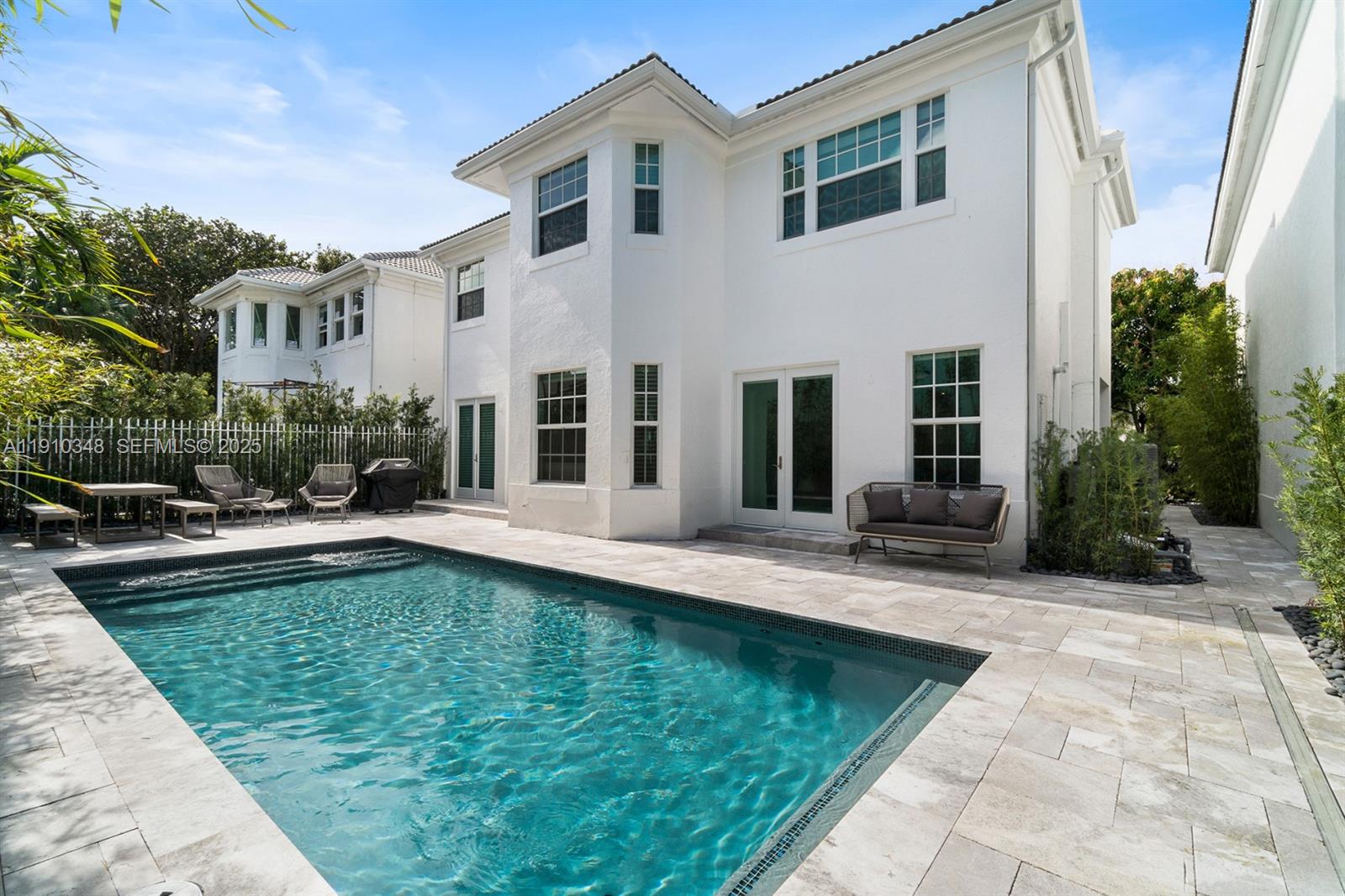 19941 Northeast 36th Place Aventura, FL 33180 - Photo 37 of 39 a view of a house with swimming pool and sitting area