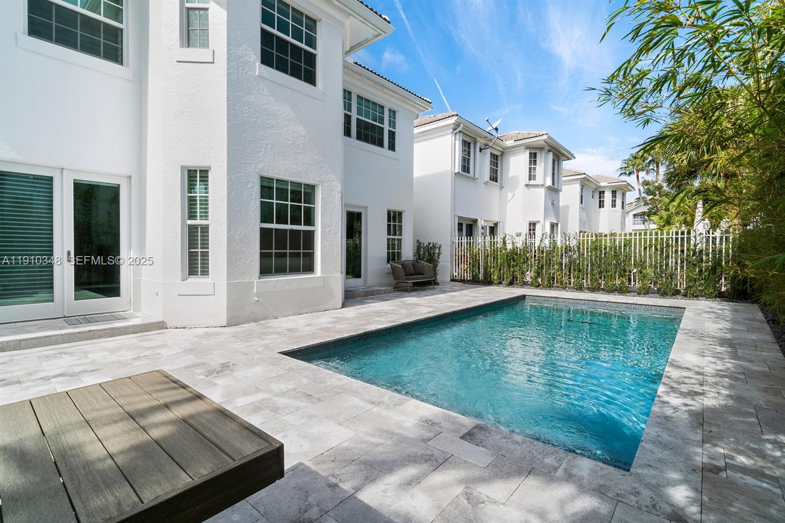 19941 Northeast 36th Place Aventura, FL 33180 - Photo 39 of 39 a view of a house with a swimming pool
