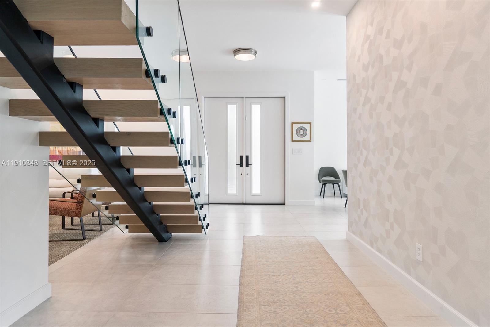 19941 Northeast 36th Place Aventura, FL 33180 - Photo 7 of 39 a view of staircase with white walls