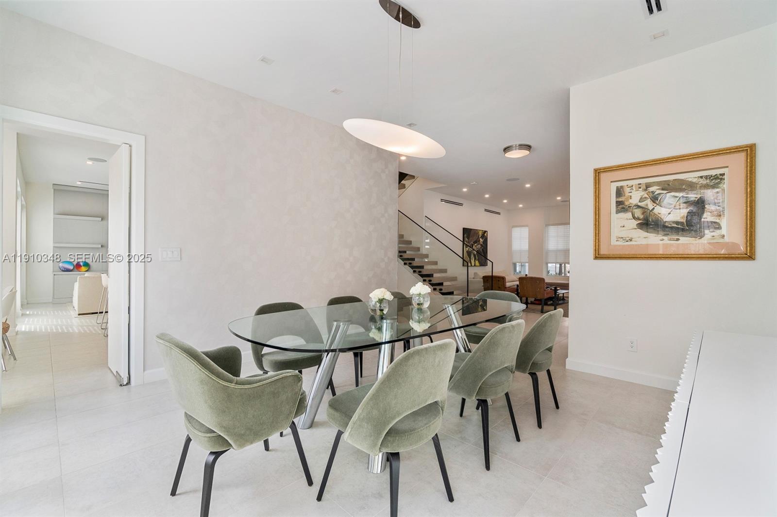 19941 Northeast 36th Place Aventura, FL 33180 - Photo 9 of 39 a view of a dining room with furniture and wooden floor