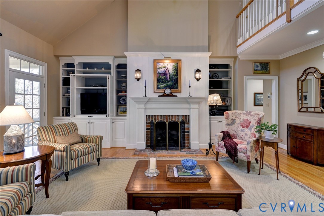 1613 River Ridge Williamsburg, VA 23185 - Photo 13 of 83 Living room featuring a high ceiling, light wood-t