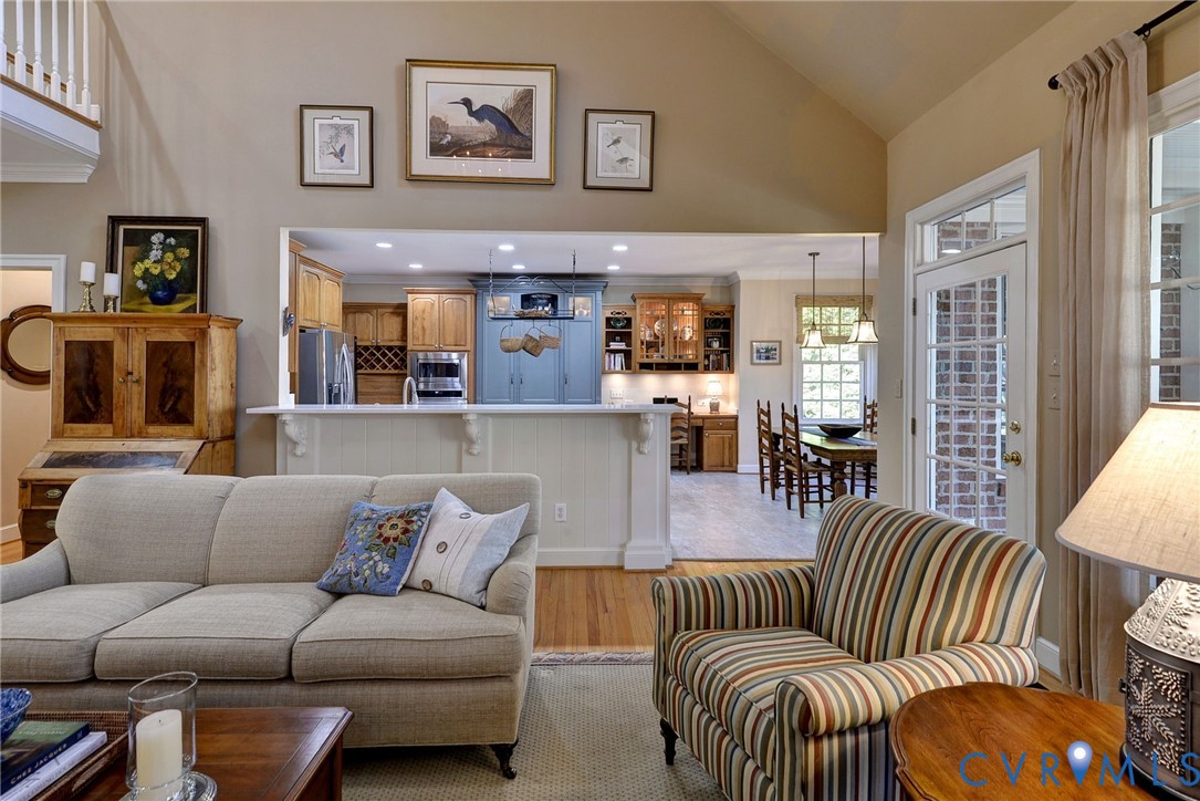 1613 River Ridge Williamsburg, VA 23185 - Photo 15 of 83 Living room featuring light wood-style floors, vau