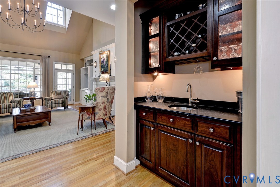 1613 River Ridge Williamsburg, VA 23185 - Photo 27 of 83 Indoor wet bar with dark wood finish cabinets, lig