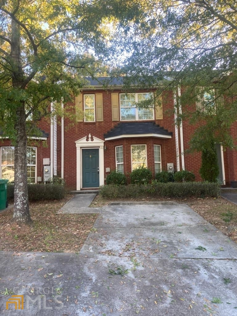 2700 Norfair Loop Lithonia, GA 30038 - Photo 1 of 1 a front view of a house with a yard and garage
