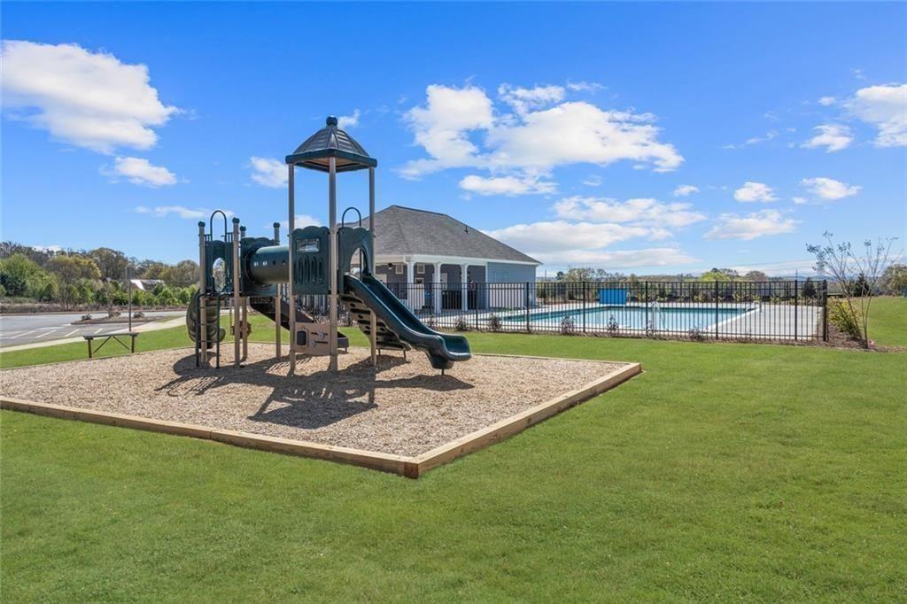 609 Mountaintop Road Cartersville, GA 30120 - Photo 48 of 49 a view of a garden with a slide