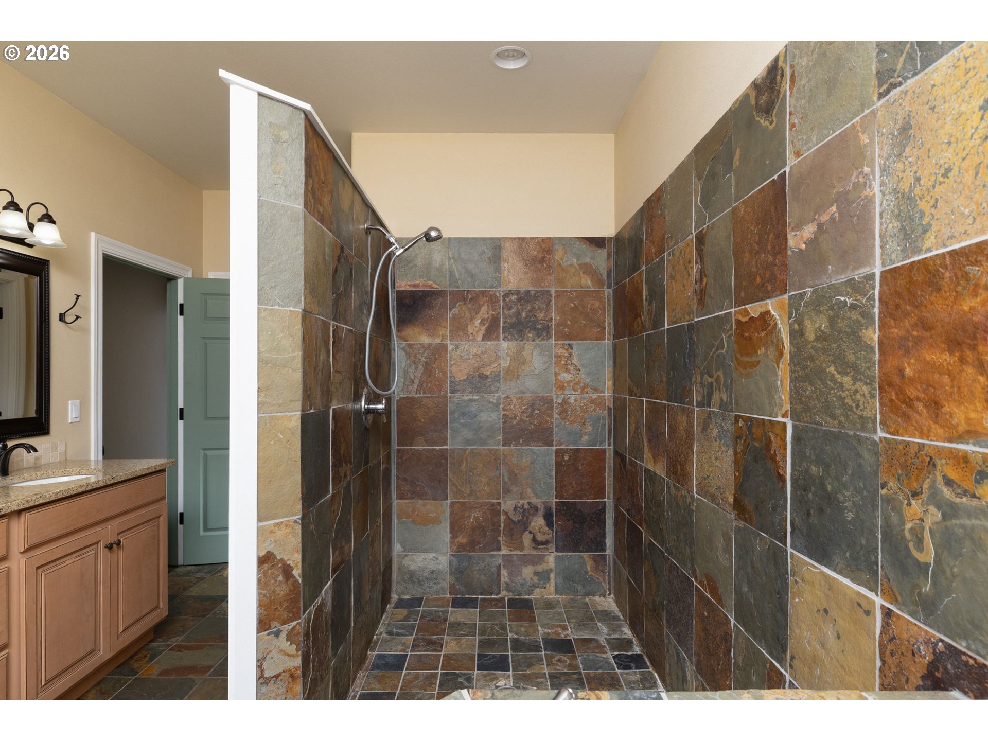20246 Gaines Court Bend, OR 97702 - Photo 17 of 37 a bathroom with a shower and a sink