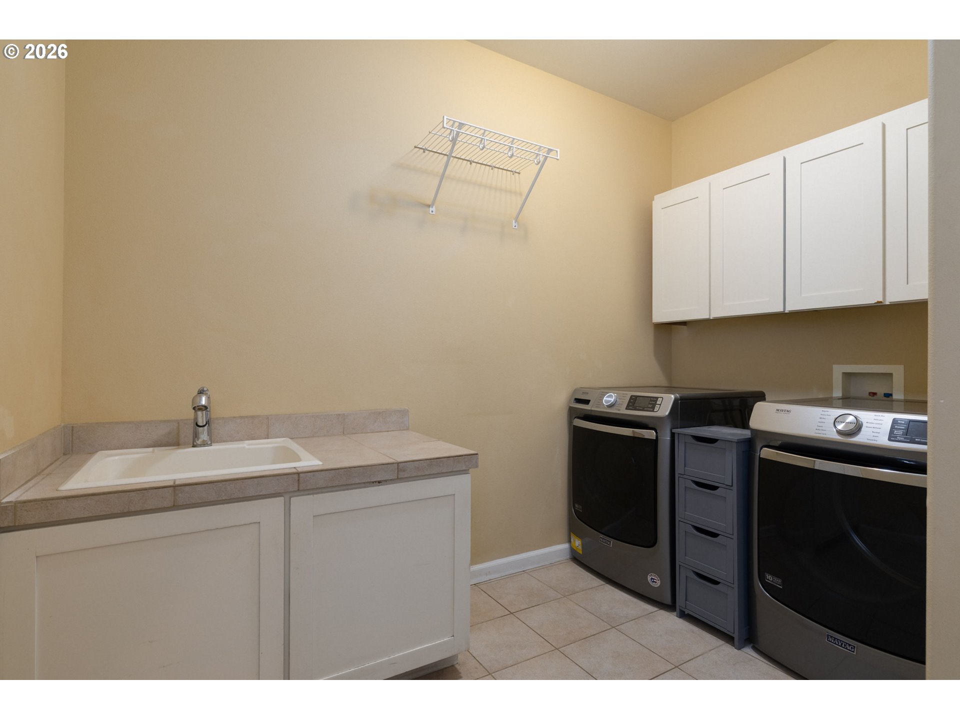20246 Gaines Court Bend, OR 97702 - Photo 22 of 37 a kitchen with a sink and cabinets