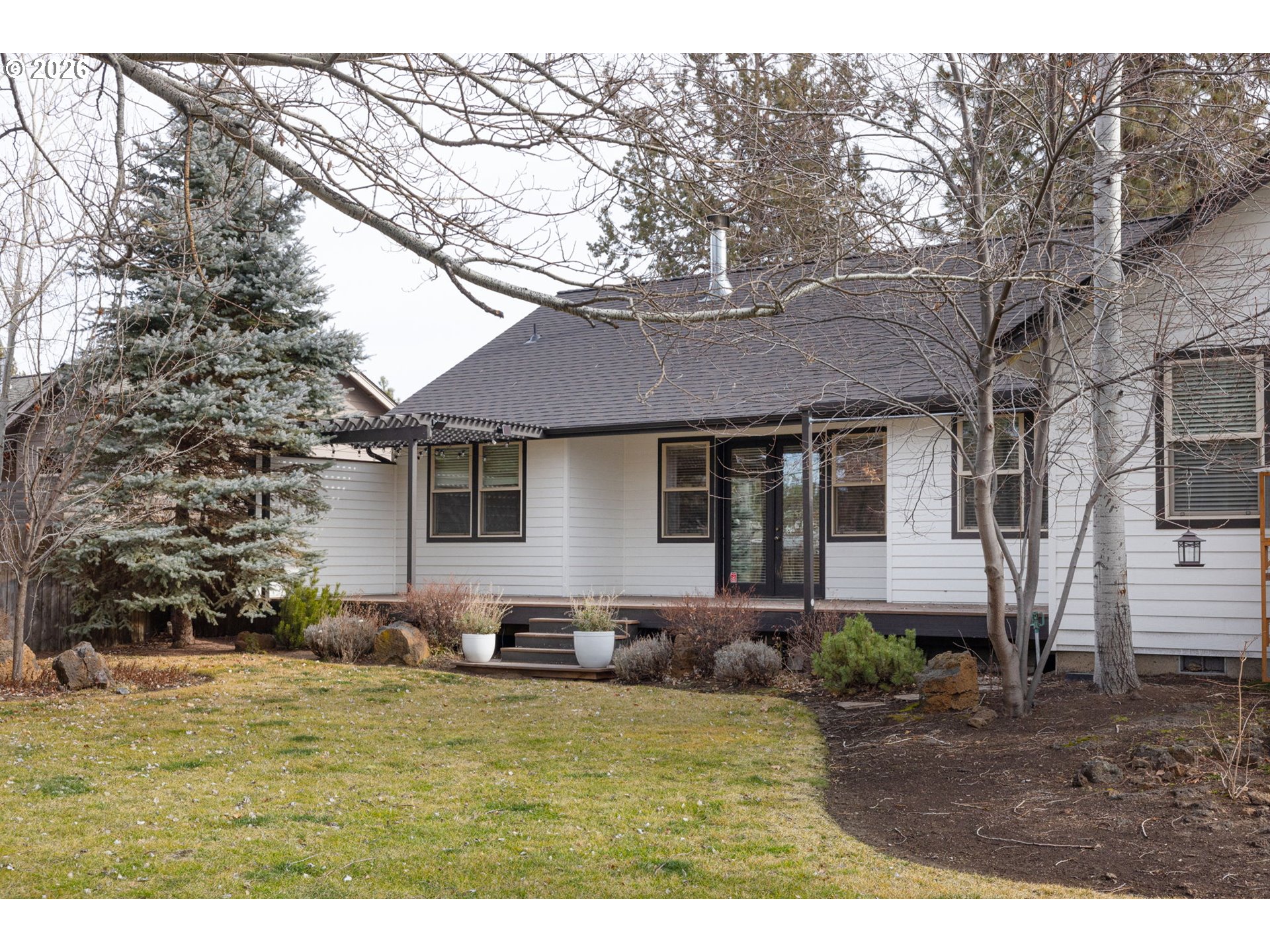 20246 Gaines Court Bend, OR 97702 - Photo 24 of 37 a front view of a house with garden