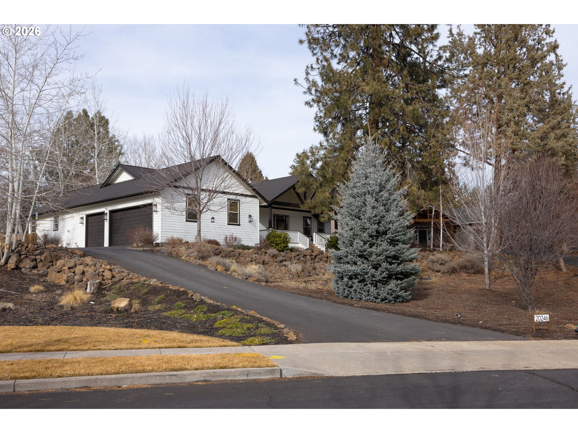 20246 Gaines Court Bend, OR 97702 - Photo 32 of 37 a front view of a house with a yard