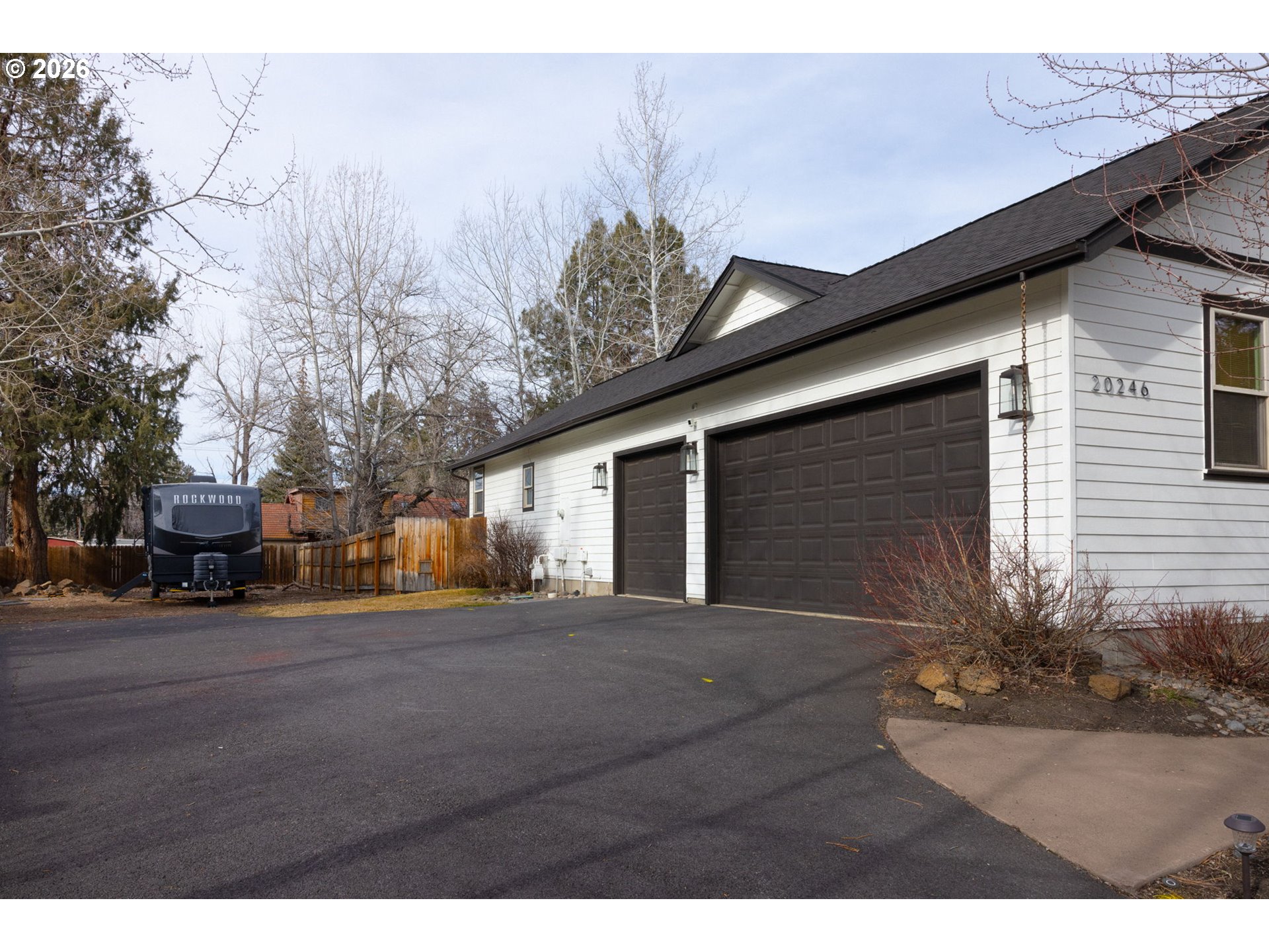 20246 Gaines Court Bend, OR 97702 - Photo 35 of 37 a view of a house with a yard and garage