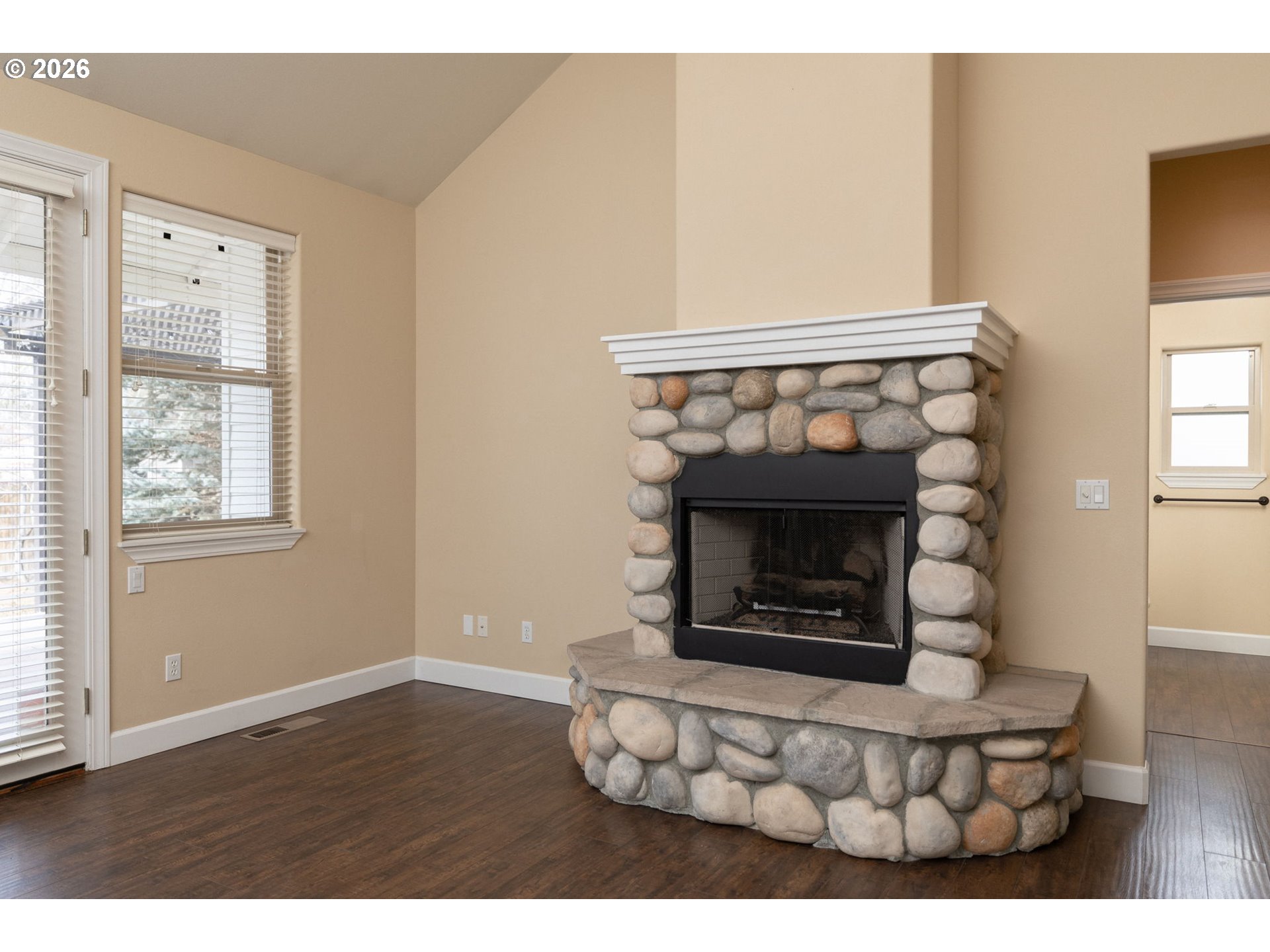 20246 Gaines Court Bend, OR 97702 - Photo 7 of 37 a living room with furniture a fireplace and window