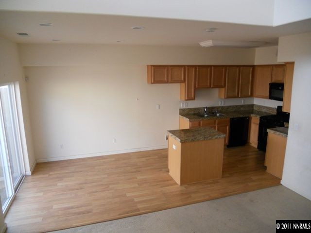 2140 Stanton Lane Reno, NV 89502 - Photo 4 of 11 a kitchen with stainless steel appliances granite countertop a stove a sink and a refrigerator