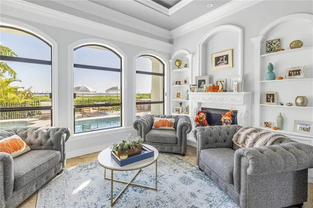 a living room with furniture fireplace and window