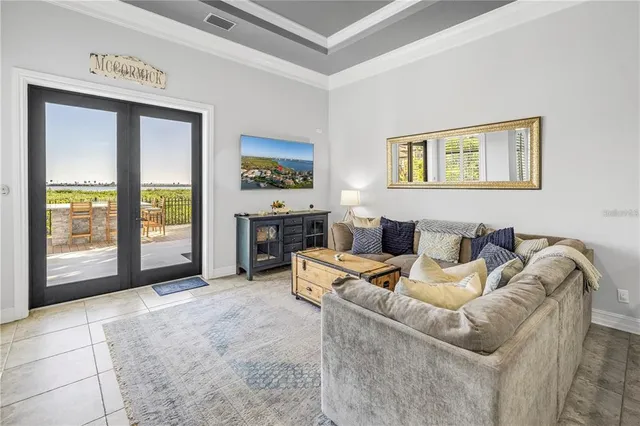 a living room with furniture and a kitchen