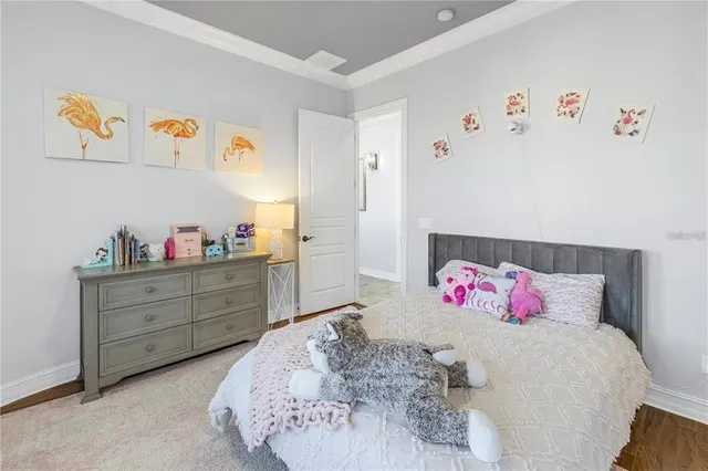 a bedroom with a bed and glass window