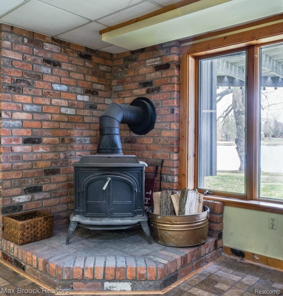 112 Clarkston Road Clarkston, MI 48346 - Photo 16 of 25 Lower Level Wood Burning Stove / Fireplace