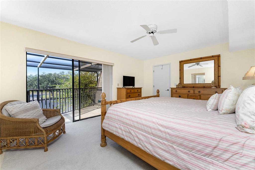 3021 Matecumbe Key Road, Unit 4 Punta Gorda, FL 33955 - Photo 20 of 42 a bedroom with a bed and a balcony